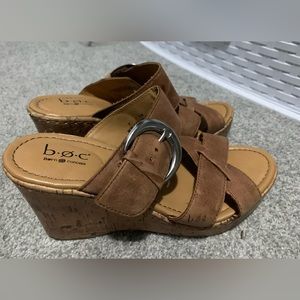 Women’s Born wedge leather strap sandals with silver buckle.